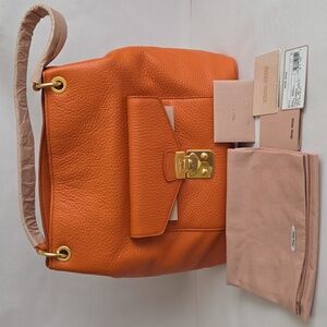 NWT Miu Miu by Prada Vitello Phenix Leather Buckle Hobo Shoulder Bag Orange